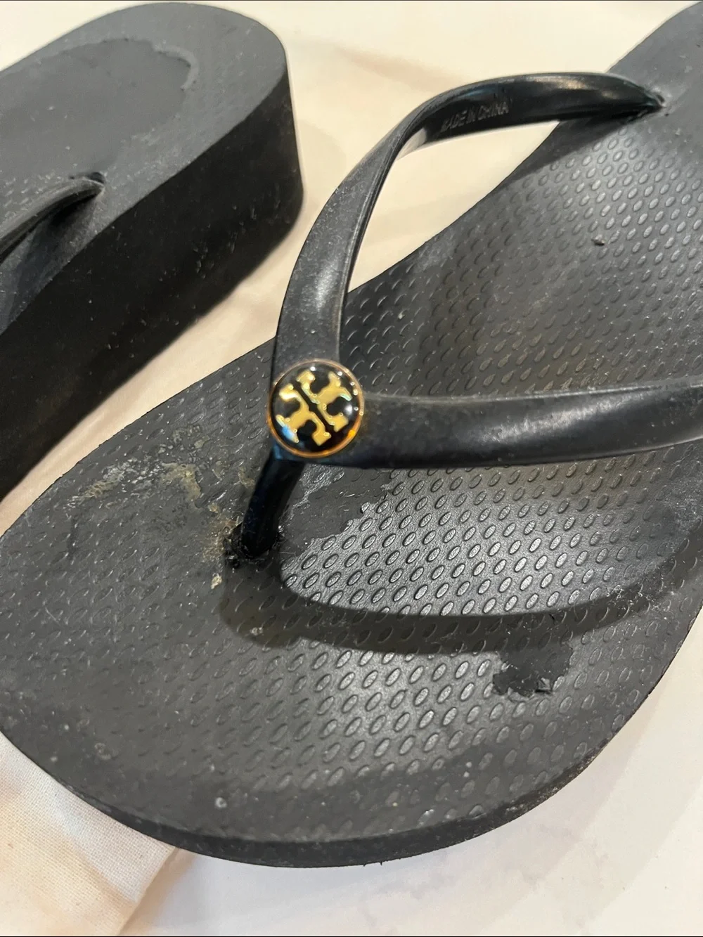 Tory Burch Black Flip-Flop Sandals with Gold Logo Discs